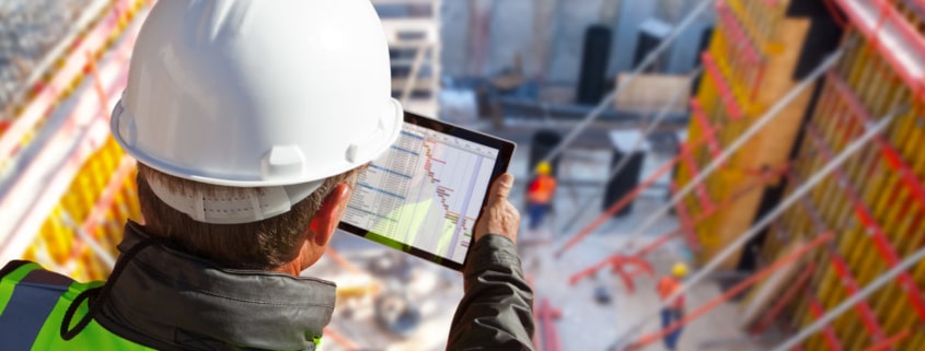 Construction Worker Using Tablet On The Job
