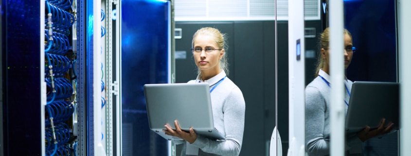 Young Woman Working in a Server Room