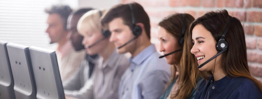 6 Tech Support Professionals Wearing Headsets