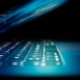 An open laptop screen illuminates the keyboard