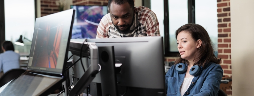 it services provider helping employee with computer issues at office