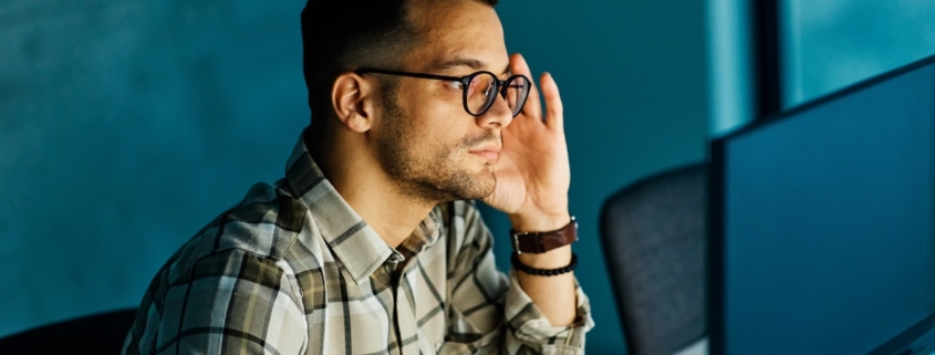 business owner using managed it services for small businesses as he work on computer