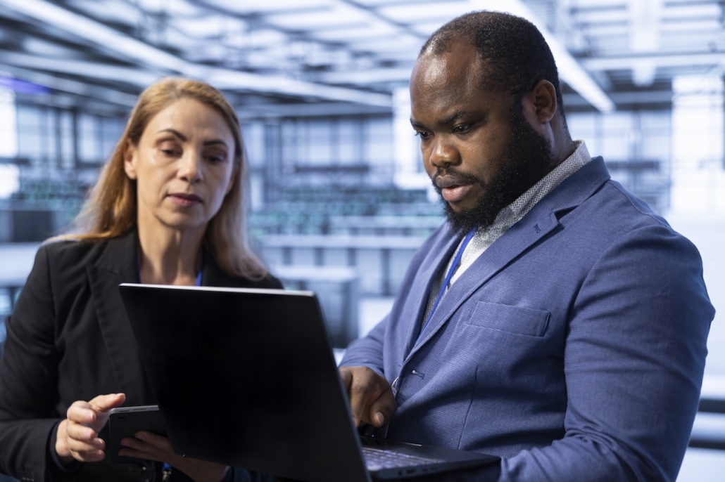 coworkers on computer using risk management tools for their small business