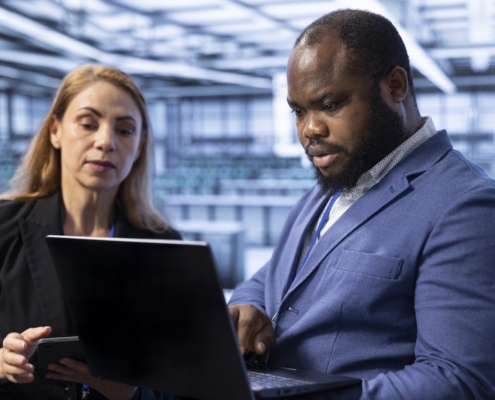 coworkers on computer using risk management tools for their small business