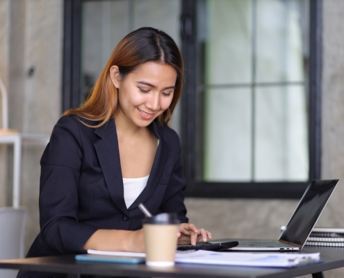 Businesswoman in accounting firm working with financial audits
