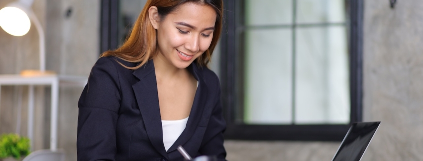 Businesswoman in accounting firm working with financial audits