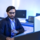 man working on computer in office with proper network security