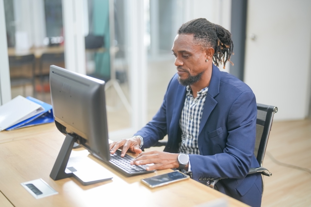 man working on computer in office