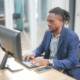 man working on computer in office