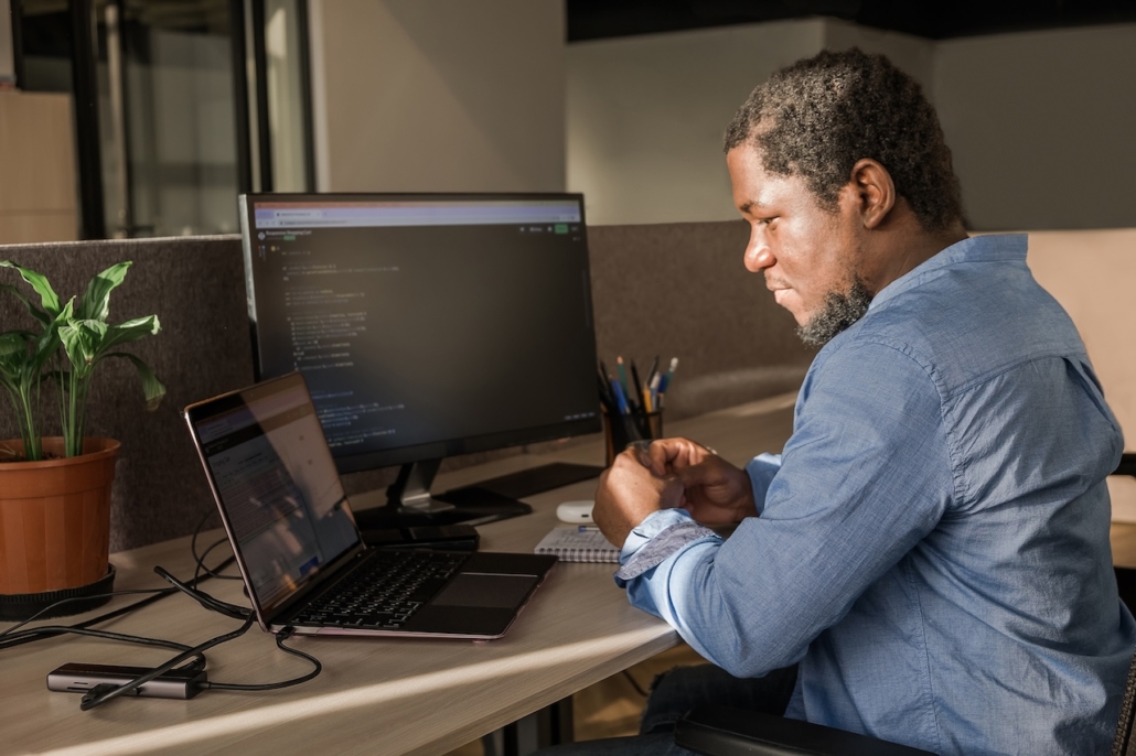 man working on computer in office