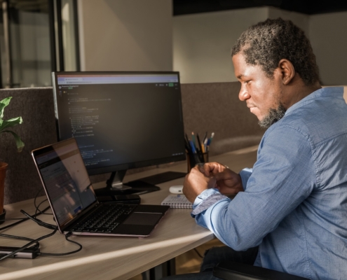 man working on computer in office
