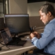 man working on computer in office