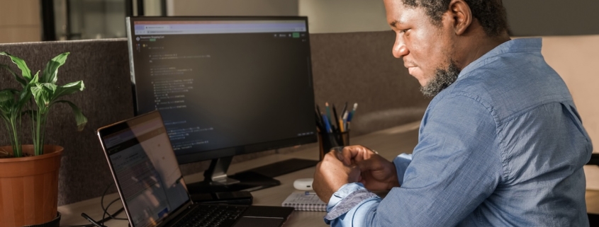 man working on computer in office