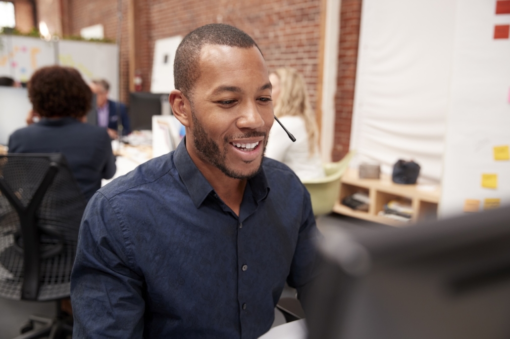 man working on computer at work