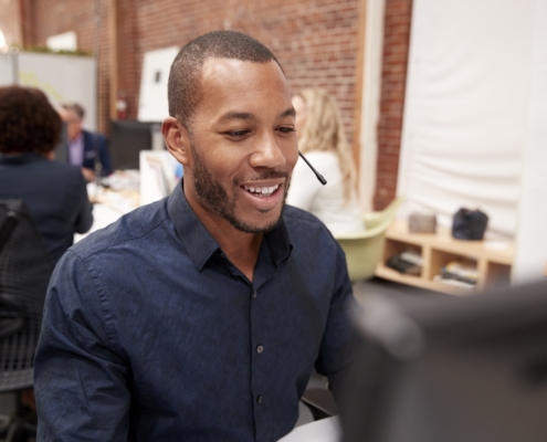 man working on computer at work