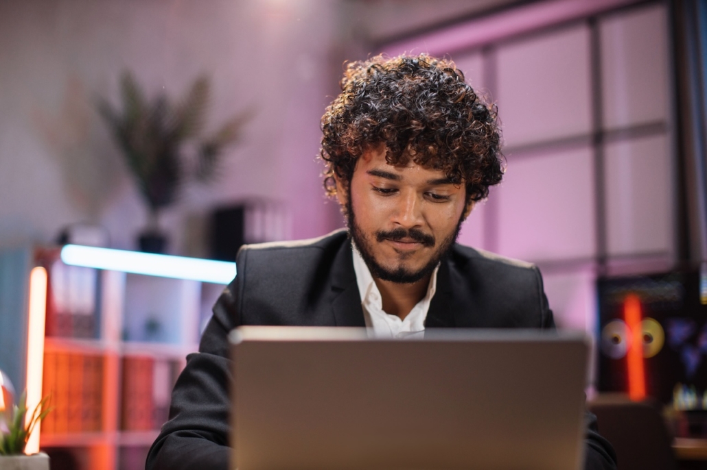 man working on laptop in office