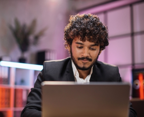 man working on laptop in office