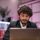 man working on laptop in office