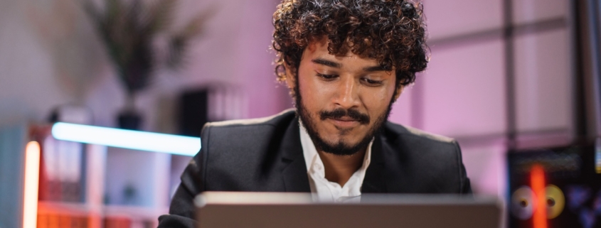 man working on laptop in office