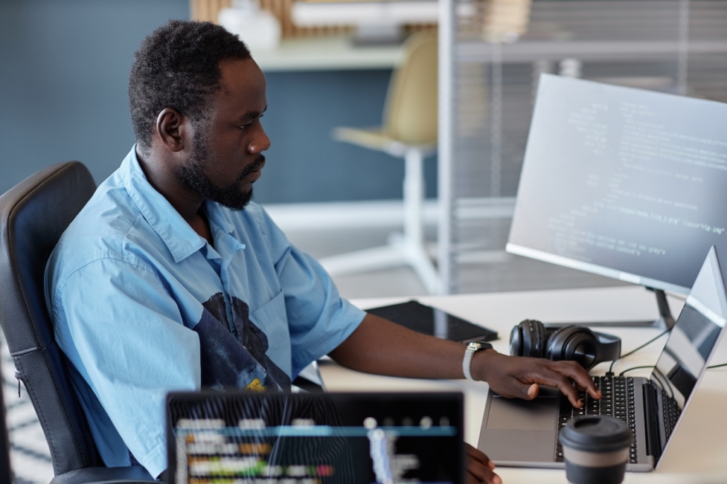 man working on computer in office
