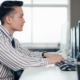man working in office on computer